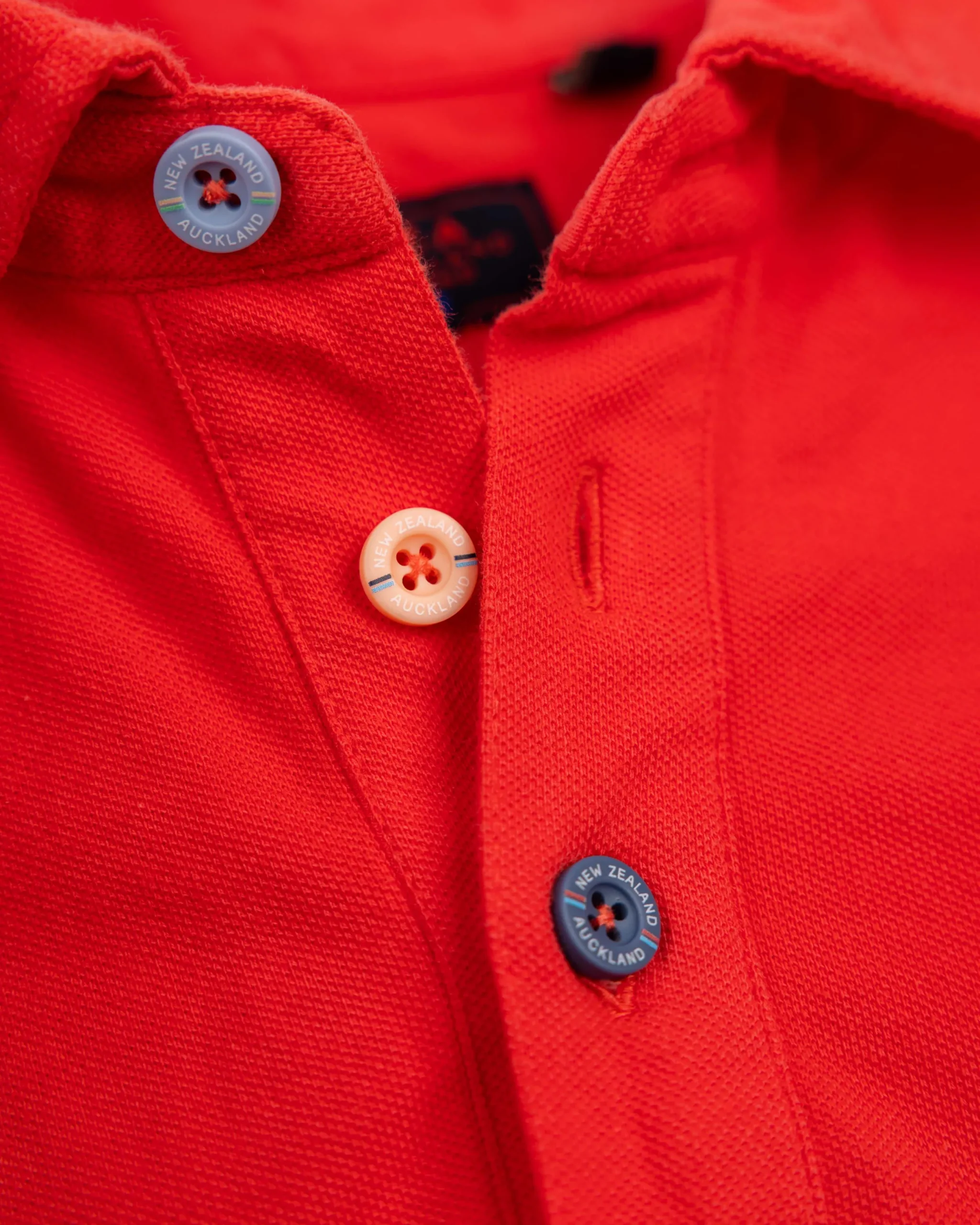 NZA New Zealand Auckland Effen katoenen roodoranje polo