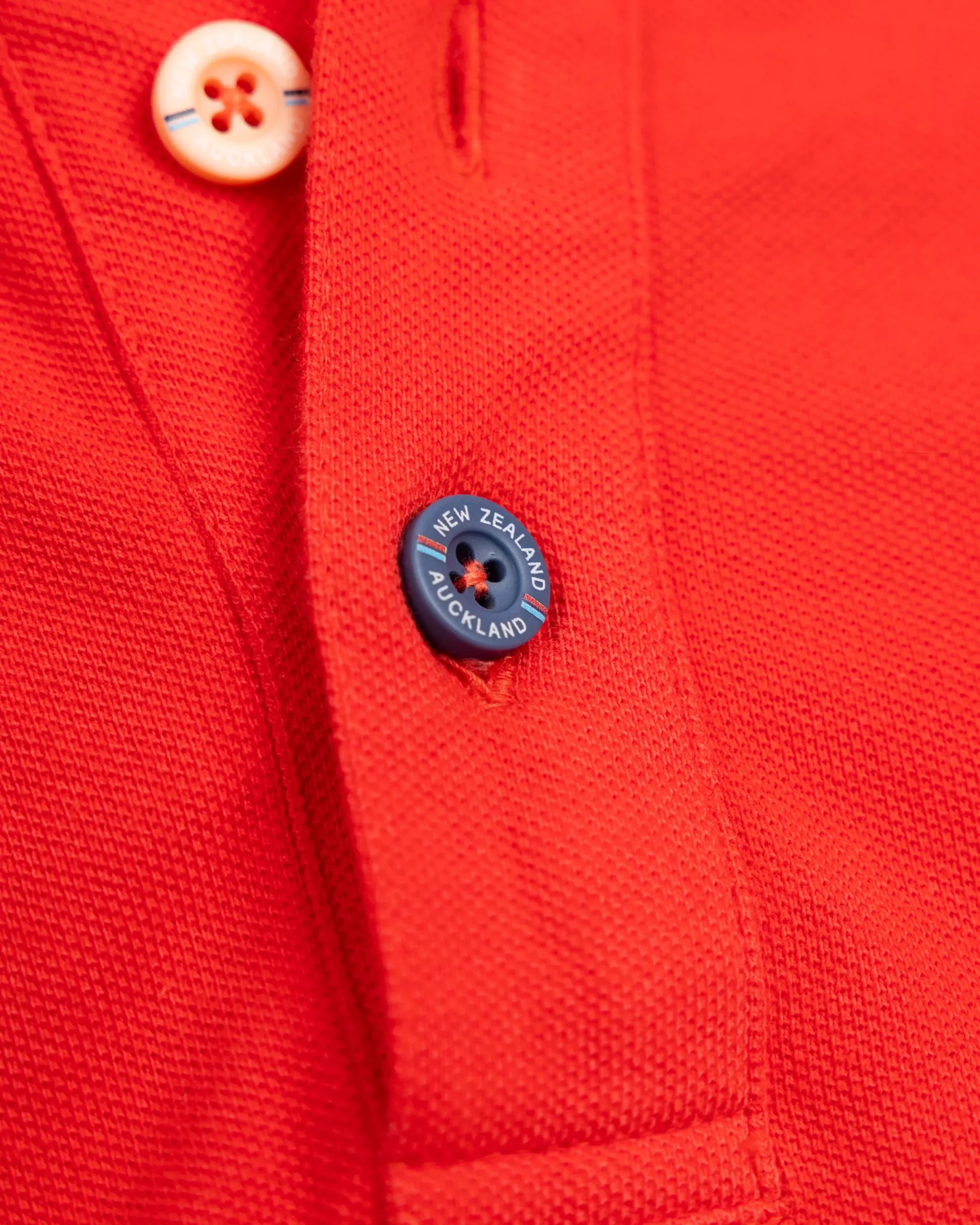 NZA New Zealand Auckland Effen katoenen roodoranje polo