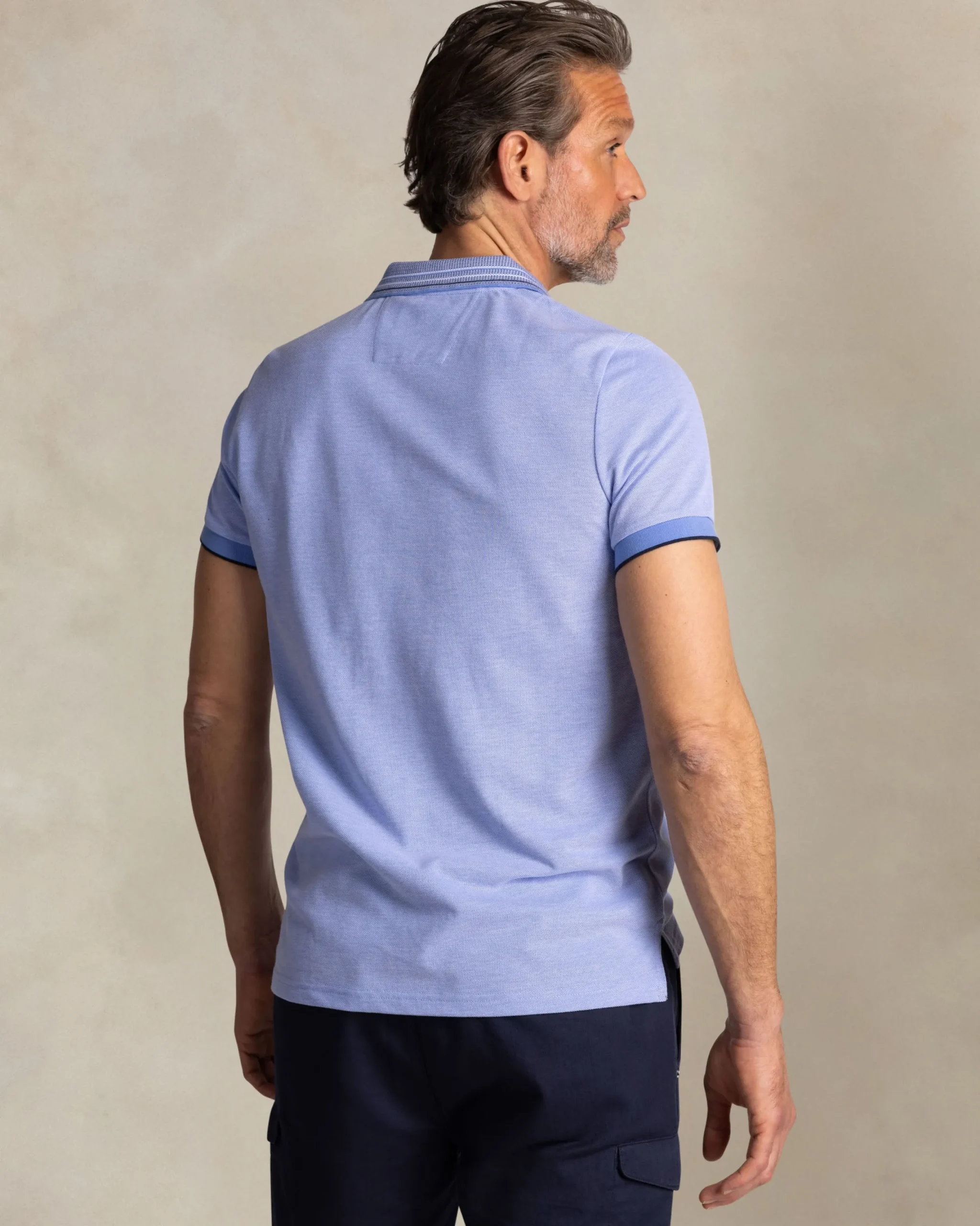 NZA New Zealand Auckland Felblauwe polo met gestreepte kraag