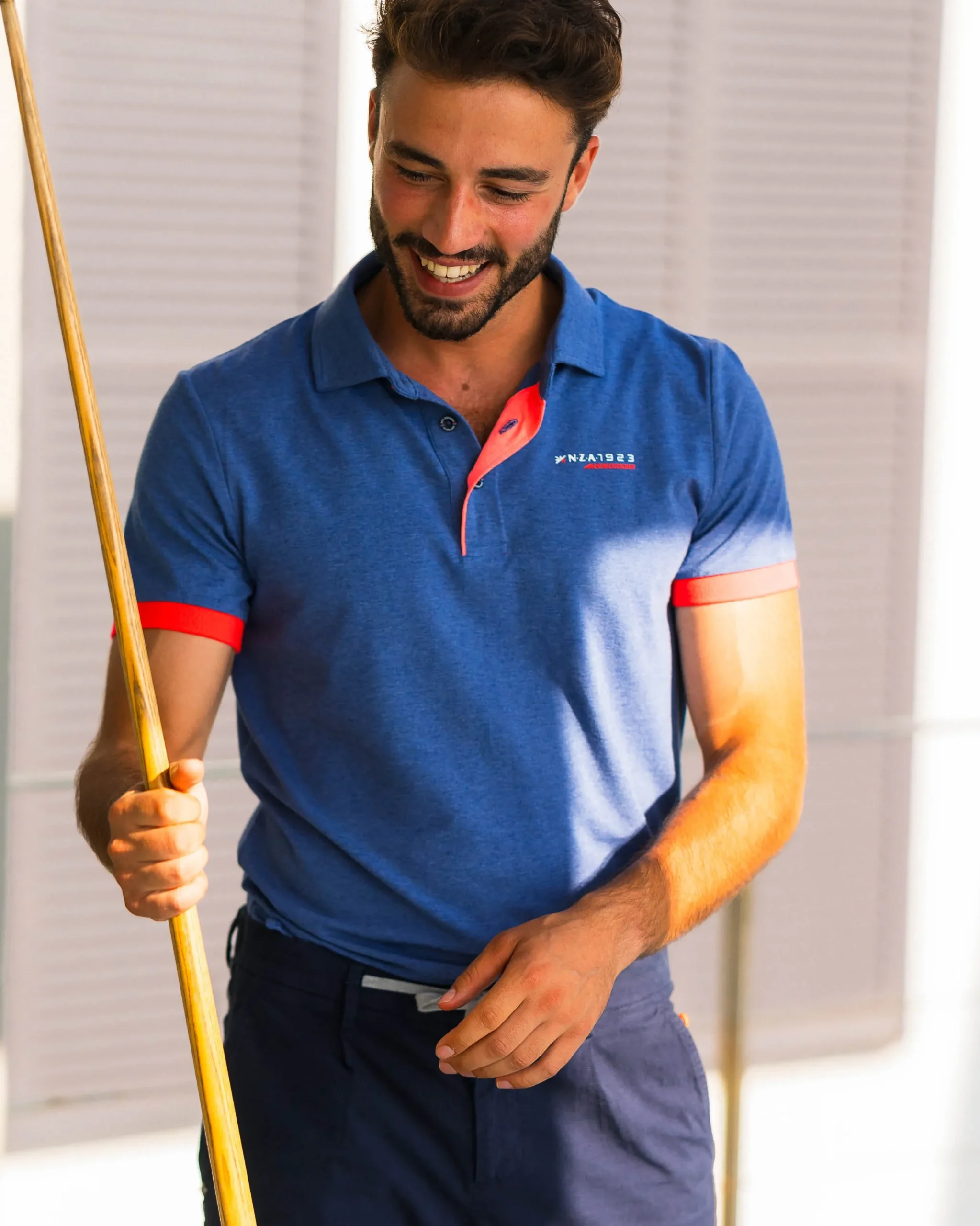 NZA New Zealand Auckland Navy polo met oranje details