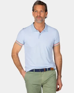 NZA New Zealand Auckland Pastelblauwe polo met oranje details